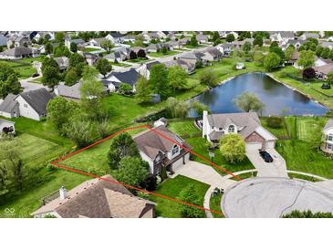 Beautiful aerial view of home with a well maintained yard and a view of the pond at 861 Stardust Ct, Franklin, IN 46131