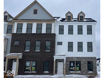 Two-story townhouses with brick and siding exteriors at 10936 Hanovarian St, Zionsville, IN 46077