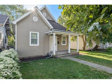 Cute bungalow exterior, featuring a covered porch and landscaping at 317 N Belleview Pl, Indianapolis, IN 46222