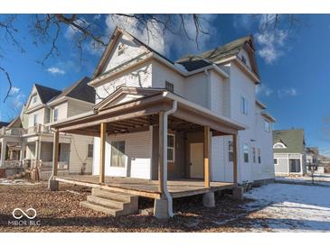 Two-story home with large front porch and mature tree. Needs renovation at 605 Hendricks St, Anderson, IN 46016