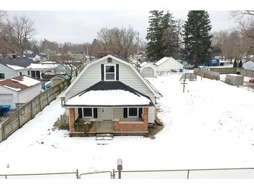 Aerial view of charming house with snow covered yard at 1175 Central Ave, Noblesville, IN 46060