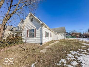 White house with gray roof, small yard, and partial snow cover at 1913 S Talbott Se St, Indianapolis, IN 46225