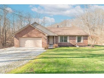 Attractive brick home with a two-car garage and a well-maintained lawn at 3510 E Copperstone Rd, Martinsville, IN 46151