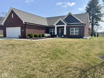 Charming brick ranch home with a manicured lawn and inviting entryway at 4543 W Meadows Ln, New Palestine, IN 46163