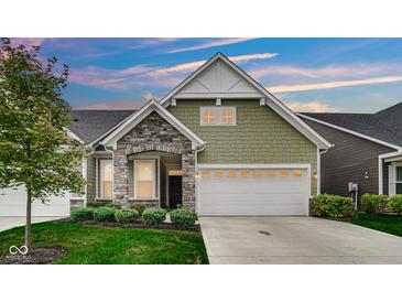 Charming craftsman style home with stone accents and a two-car garage at 17083 Cole Evans Dr, Noblesville, IN 46060