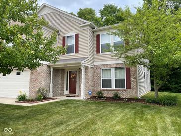 Two-story house with brick and siding, red shutters, and a well-manicured lawn at 10391 Butler Dr, Brownsburg, IN 46112