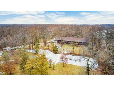 Secluded long home nestled in the woods near a pond at 9600 N 500 E, Pendleton, IN 46064