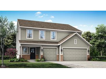 Two-story house with green siding, brick accents, and a two-car garage at 5904 Sunstone Rd, Indianapolis, IN 46239