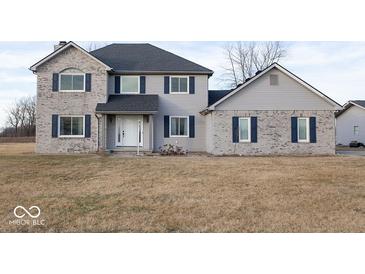 Charming two-story home with gray siding, blue shutters, and a well-maintained front yard at 9222 W State Road 38, Lapel, IN 46051