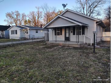 Picture of the house with a porch and well kept yard. Perfect for families or individuals at 3619 N Hawthorne Ln, Indianapolis, IN 46218