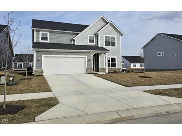 Charming two-story home with a gray exterior, attached garage, and a well-maintained lawn at 19723 Atwater Ave, Sheridan, IN 46069