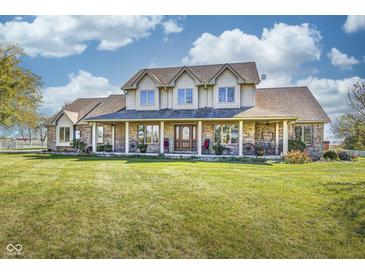 Expansive home featuring a large front porch, spacious lawn, and traditional design elements at 3101 E State Road 47, Lebanon, IN 46052