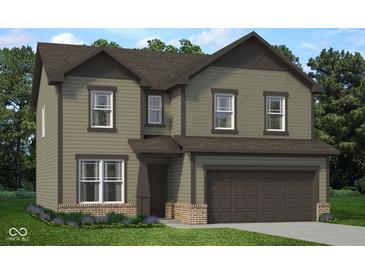 Charming two-story home featuring an attached two-car garage and a well-manicured lawn with garden at 349 N Post Oak Dr, Mooresville, IN 46158