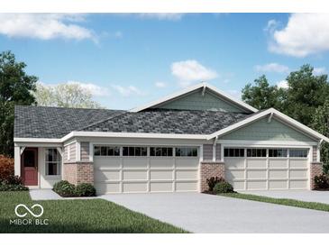Three-unit townhome building with brick and siding exterior, two-car garages, and landscaping at 10349 Gateway Dr, Brownsburg, IN 46234