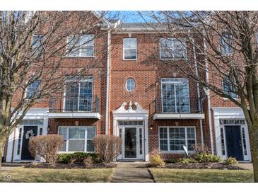 Brick townhouse with front door, walkway, and landscaping at 15314 Mystic Rock Dr, Carmel, IN 46033