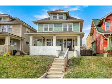 Two-story home with a covered front porch and well-maintained lawn at 3356 N Park Ave, Indianapolis, IN 46205