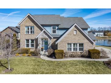 Charming two-story home with brick and stone accents, a manicured lawn, and a welcoming front entrance at 377 Morningside Dr, Brownsburg, IN 46112