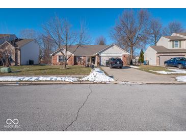 Brick ranch home with attached garage and landscaping at 6264 Whitaker Farms Dr, Indianapolis, IN 46237
