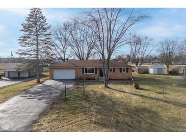 Ranch house with a long driveway and a large backyard at 3052 S Fielding Rd, New Palestine, IN 46163