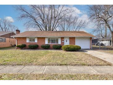Brick ranch house with attached garage and well-maintained lawn at 2832 S Oakland Ave, Indianapolis, IN 46203