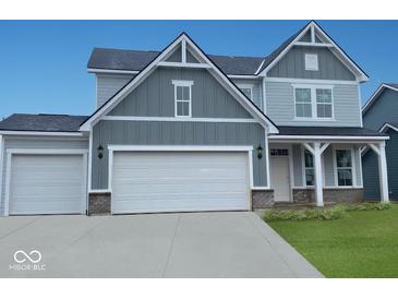 Charming two-story home with gray siding, white trim, two-car garage, and welcoming front porch at 552 Bluestem Ln, New Whiteland, IN 46184