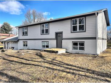 Charming two-story home with a combination of painted brick and siding and updated windows at 6775 N County Road 550 E, Brownsburg, IN 46112