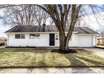 Charming single-story home with white siding, black door, and an attached one car garage at 8815 Frontenac Rd, Indianapolis, IN 46226