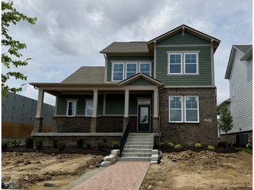 Charming two-story home featuring a welcoming front porch and a combination of brick and siding exterior at 19997 Old Dock Rd, Westfield, IN 46074