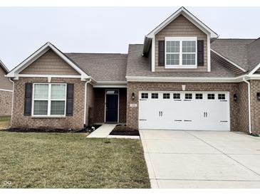 Charming single-Gathering home boasting a brick facade, complemented by a two-car garage and well-maintained lawn at 253 Darrough Dr, Greenwood, IN 46143