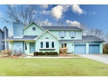 Charming two-story home with attached two-car garage and beautifully maintained lawn at 11710 E 75Th St, Indianapolis, IN 46236