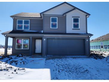 Charming two-story home featuring gray siding and a spacious two-car garage, perfect for modern living at 3251 W Keepsake Ln, Monrovia, IN 46157