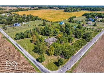 Expansive aerial view showcases a large home with mature trees on a sprawling, well-maintained lawn at 4030 W 193Rd St, Westfield, IN 46074