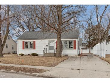 Charming home showcasing its curb appeal with a well-manicured lawn and inviting facade at 518 E College Ave, Brownsburg, IN 46112
