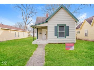 Charming single-Gathering home with a well-maintained lawn and inviting entrance at 1343 Edgemont Ave, Indianapolis, IN 46208