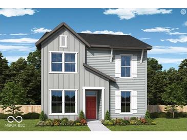 Charming two-story home showcasing classic architectural style with a well-manicured front yard and inviting red door at 780 James William Ln, Westfield, IN 46074