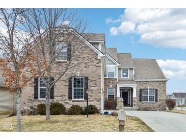 Charming two-story brick home with well-maintained lawn and inviting curb appeal at 14402 Wolverton Way, Fishers, IN 46037