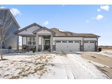 Charming single-story home featuring a two-car garage and welcoming front porch at 20170 Edwick Dr, Westfield, IN 46074
