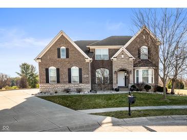 Beautiful two-story brick home featuring well-manicured lawn and professional landscaping at 4431 Hickory Stick Row, Greenwood, IN 46143