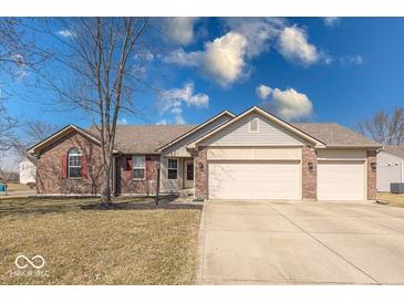 Charming single-story home with brick facade, two car garage, and well-manicured lawn at 6608 Rushing, Noblesville, IN 46062