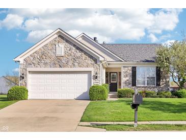 Charming single-Gathering home with stone facade, attached two-car garage, and well-manicured lawn at 12880 Oxbridge Pl, Fishers, IN 46037