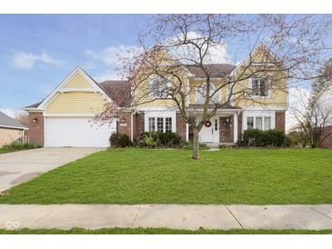 Charming two-story home with a manicured front yard and a welcoming entrance at 21360 Oakview Dr, Noblesville, IN 46062