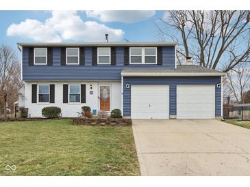 Charming two-story home with a well-manicured lawn and two-car garage at 455 Meadowview Ln, Greenwood, IN 46142
