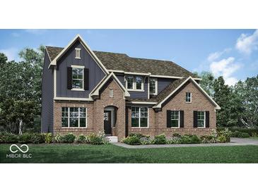 Beautiful new construction home featuring a brick and siding exterior, complemented by a well-manicured lawn and landscape at 9101 Rockville Pl, McCordsville, IN 46055