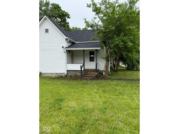 Charming home featuring a covered front entrance and green lawn at 2312 Fletcher St, Anderson, IN 46016