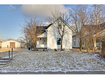 Charming renovated home featuring a well-maintained lawn and classic white siding at 2312 Fletcher St, Anderson, IN 46016