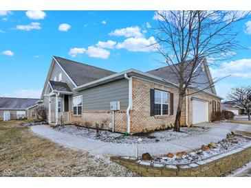 Attractive brick and siding exterior with well-maintained lawn and landscaping at 660 Overcup St, Westfield, IN 46074