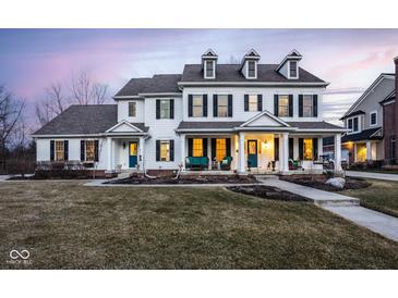 Stately two-story home featuring symmetrical design, dormer windows, and inviting front porch at 13139 Dumbarton St, Carmel, IN 46032