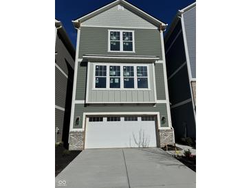 Charming new construction with two-car garage and craftsman-style details, perfect for modern living at 15403 Mystic Rock Dr, Carmel, IN 46033