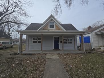 Charming one-story home with a covered front porch and welcoming facade at 952 N Concord St, Indianapolis, IN 46222