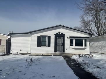 Charming one story house with a secure front door and clean white siding at 2306 Finley Ave, Indianapolis, IN 46203